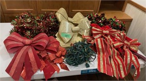 Christmas garland, lights, assortment of bows