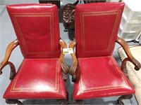 PAIR OF RED CARVED WOOD ARM CHAIRS