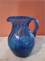 Six and a half inch blue glass pitcher