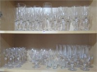 (2) Shelf fulls of glass stemware.