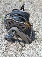 Garden hose 100 foot and storage roller..