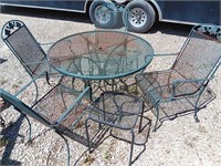 Patio set metal table 38.  4 chairs 20x19x48. 1
