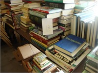 Extensive table lot of various hard and paperback