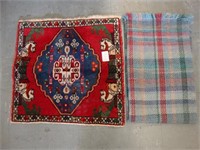 Scottish wool rug along with a Persian wool rug.