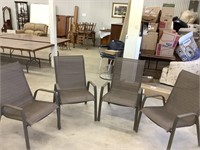Four metal and canvas outdoor lounge chairs,