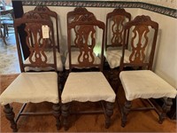 6 dining chairs. Appear to be antiques.