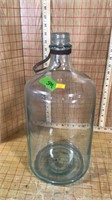 Glass jug with metal handle