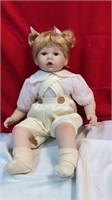 Sitting porcelain girl doll/ yellow shorts