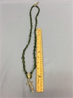 jade necklace with religious medals