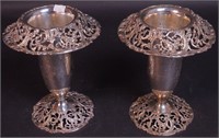 A pair of reticulated 8" high vases marked