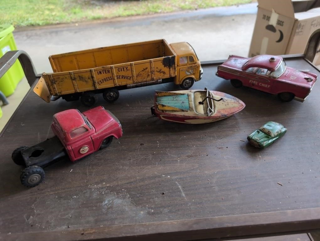 Vintage metal fire chief car, boat, Shell truck,