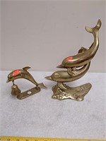 2 brass dolphin figurines