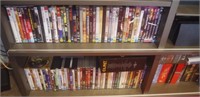 Three shelves of DVDs, etc,