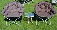 Two oversized folding camp chairs and small side t