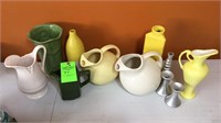 Assorted pitchers, vases, and candlestick holders