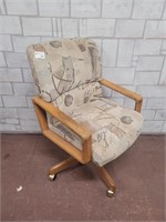 Solid chair on wheels in good condition