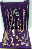 Jewelry lot includes necklaces and earrings on