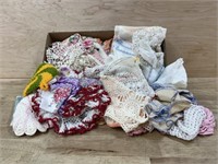 Flat of old doilies