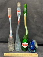 3 bottles and glass fruit