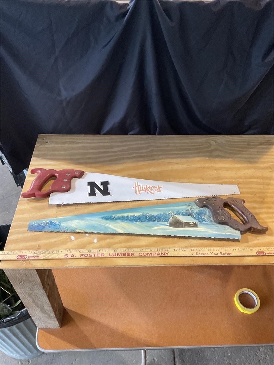 Hand painted saw and Husker saw