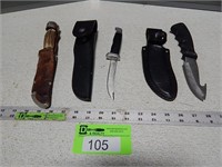 Hunting knives with sheaths; 1 is a Buck knife