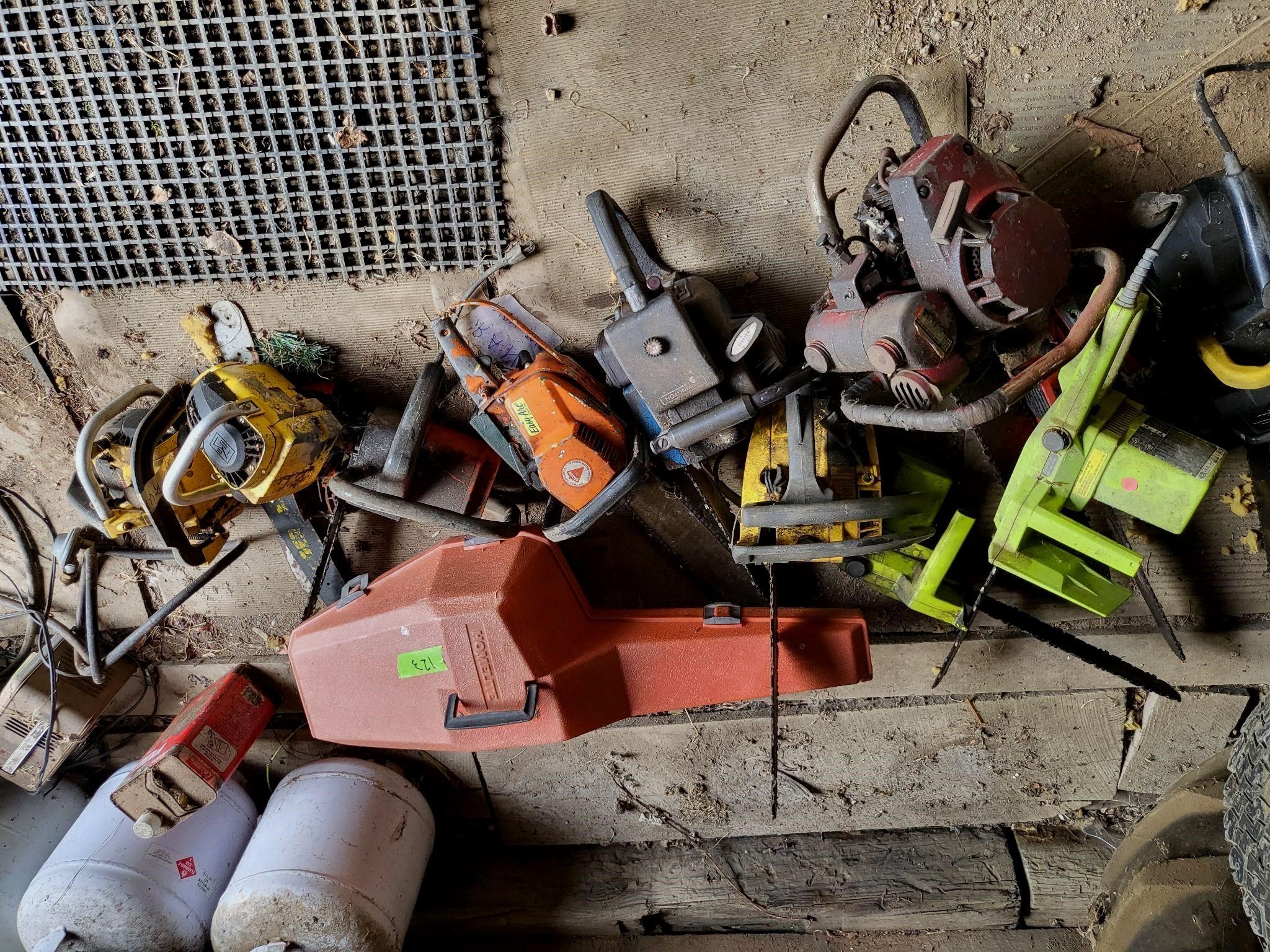 Large lot of vtg chainsaws