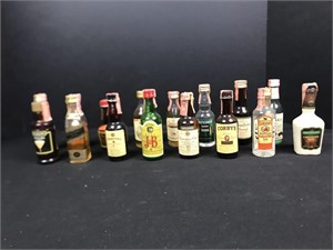 Miniature collector bottles some with contents