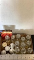 Golf balls, strip caps and glass spice jars