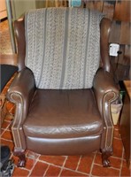 Brown leather reclining wing chair; as is