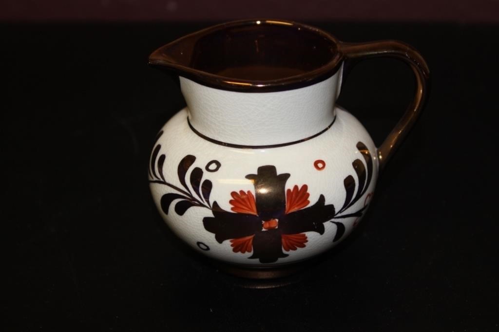 An Old Castle Copper Ceramic Luster Creamer