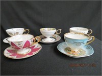 Collection of 5 footed cups and saucers