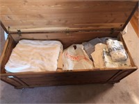 Contents of cedar chest- sheets, curtains,