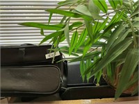 LAPTOP BAGS AND BRASS POT WITH ARTIFICIAL PLANT