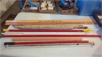 YARDSTICKS- HANDLES OF VARIOUS BROOMS AND SUCH-