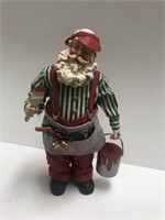 Santa Claus figure with paintbrush and paint