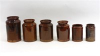 (6) redware storage jars. Early 19th century.
