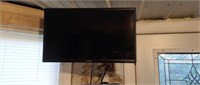 Vizio 24 inch flat screen TV with remote and wall