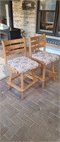 2 solid oak upholstered swivel bar stools,
