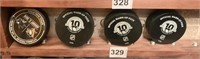 4 NHL HOCKEY PUCKS