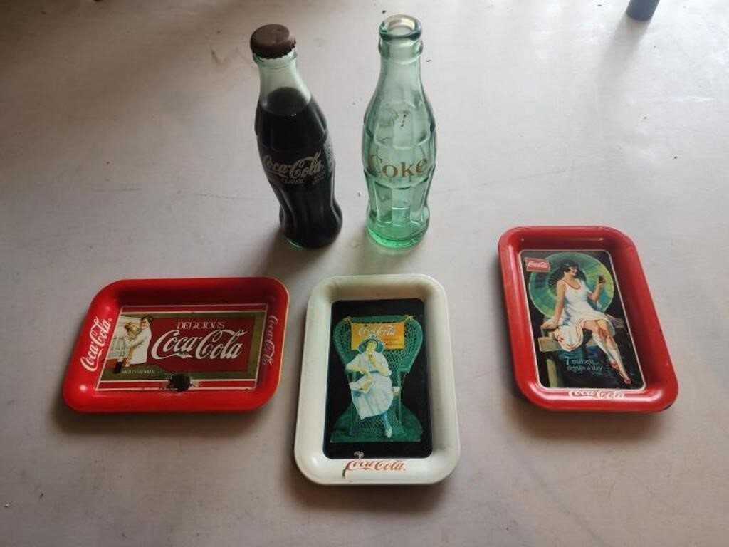 3 coca cola tins, coca cola bottles