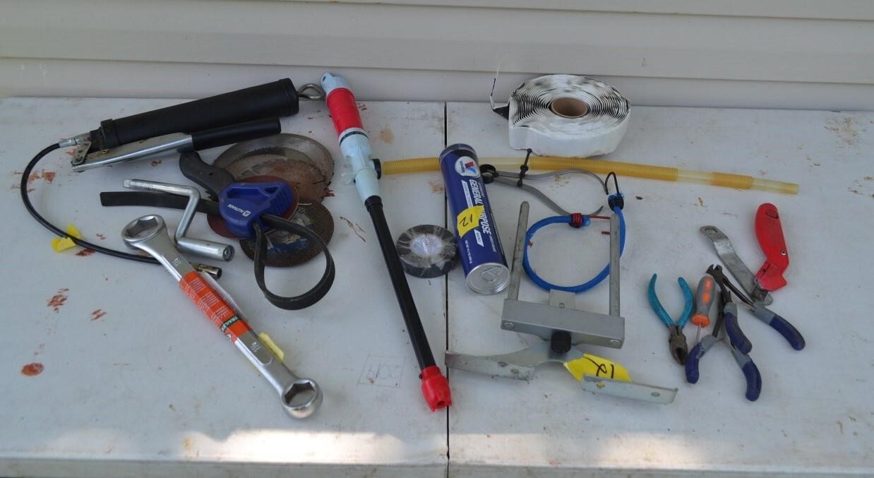 12: Assorted tools, fuel transfer pump, etc