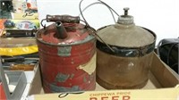 Two kerosene containers one metal one glass