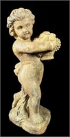 CAST RESIN FIGURE OF BOY CARRYING FRUIT