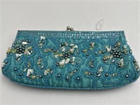 KATE LANDRY SHELL AND BEAD DECORATED CLUTCH