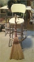 Antique child's stool and handmade broom