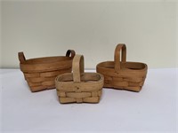 Three small decorative baskets