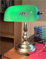 Banker bras and green glass lamp