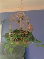 Old bird cage with artifical decor