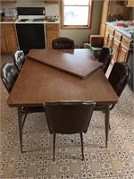 Kitchen table with six chairs and one leaf