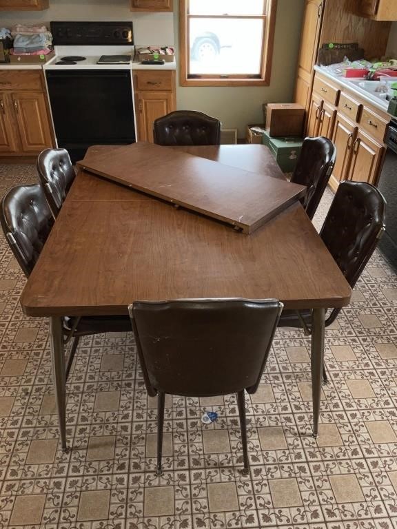 Kitchen table with six chairs and one leaf